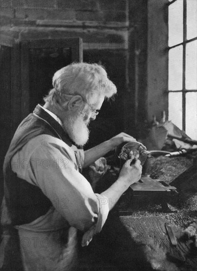 A watch cap maker at work, 1911-1912.Artist: AL Hitchin