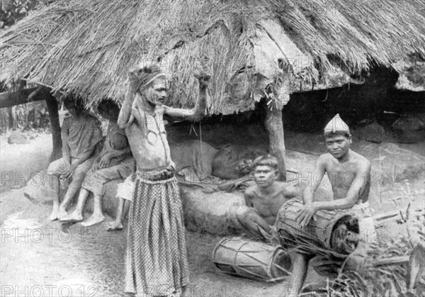 A sorcerer ejecting a spirit from a sick man in South India, 1926. Artist: Unknown