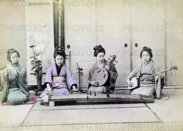 Geisha playing traditional musical instruments, Japan, 1880. Artist: Unknown