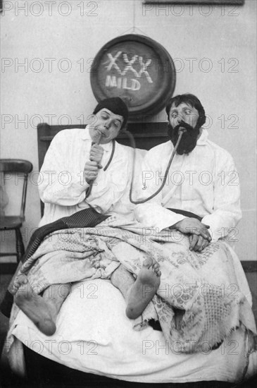 Two drunken men in a bed, 1906. Artist: Unknown