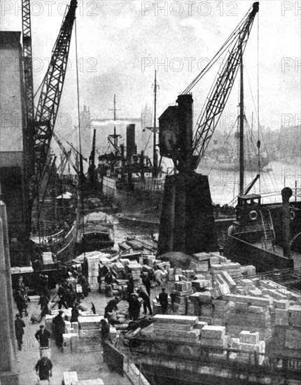 Cargo being unloaded at the docks, Upper Pool, London, 1936.Artist: Fox