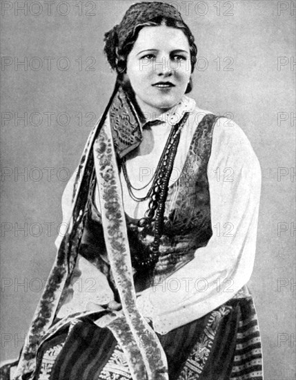 Lithuanian woman in traditional dress, 1936. Artist: Geoffrey L Portham