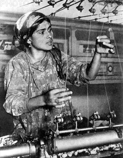 Woman working in the silk industry, Samarkand, Uzbekistan, 1936. Artist: Unknown