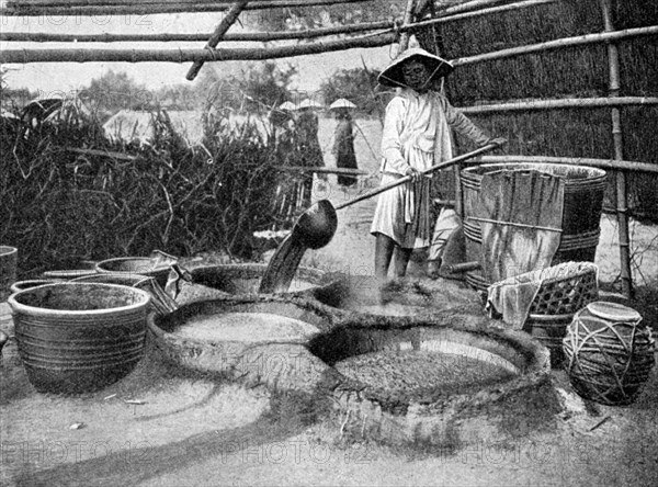 Clarifying sugar cane juce, Annam, Vietnam, 1922. Artist: Unknown