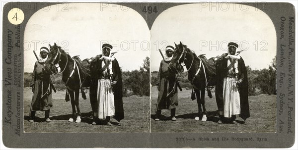 A sheikh and his bodyguard, Syria, 1900s.Artist: Keystone