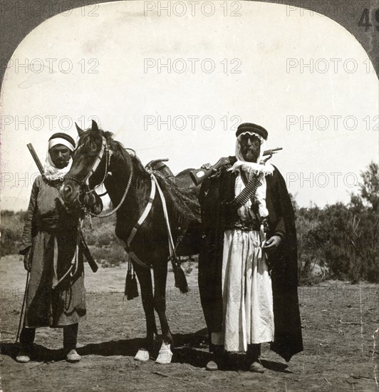 A sheikh and his bodyguard, Syria, 1900s.Artist: Keystone