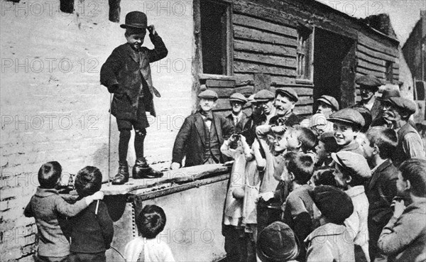 A budding Charlie Chaplin admirer, east end of London, 1926-1927. Artist: Unknown