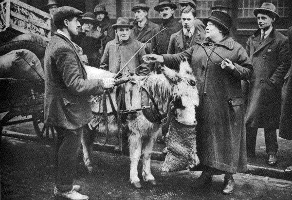 A 'whip woman', Covent Garden, London, 1926-1927.Artist: McLeish