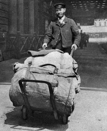 A train porter, London, 1926-1927. Artist: Unknown