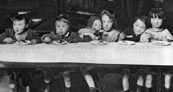 East End children being fed by a charitable organisation, London, 1926-1927. Artist: Unknown