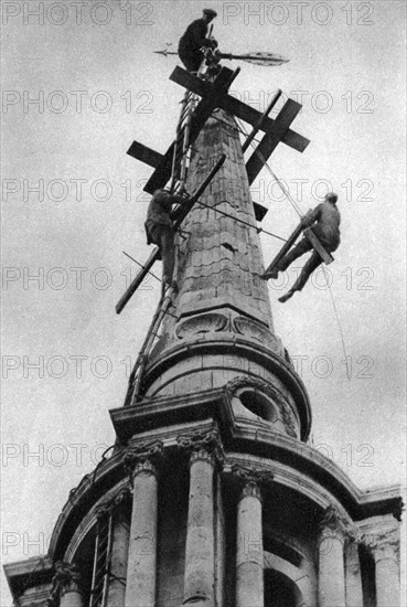 Steeplejacks on the spire of All Saints Church, Poplar, London, 1926-1927. Artist: Unknown