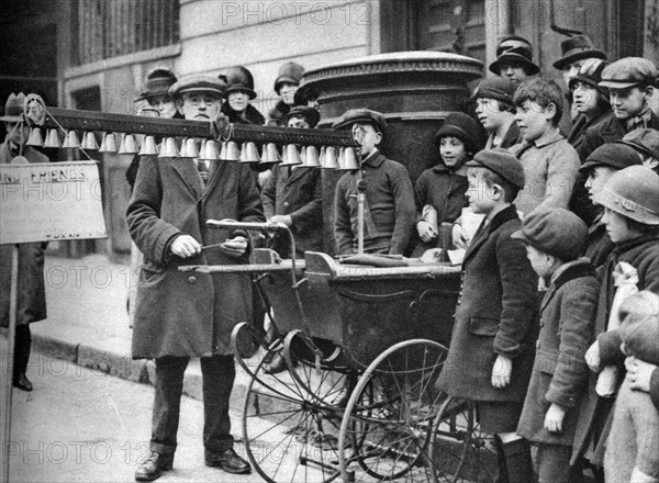 A bell busker, London, 1926-1927.Artist: McLeish