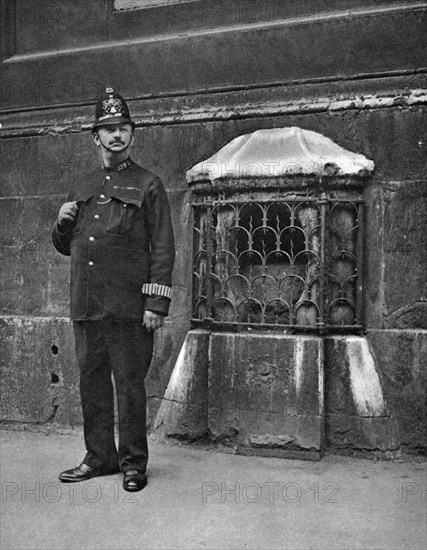 The London Stone in the wall of St Swithin's, Cannon Street, London, 1926-1927. Artist: McLeish