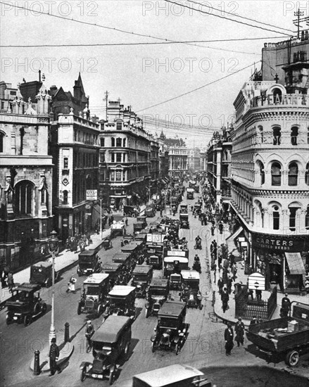 Queen Victoria Street at its intersection with Cannon Street, London, 1926-1927. Artist: Frith