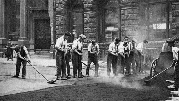 Workmen laying tar and asphalt in Cornhill, London, 1926-1927. Artist: McLeish