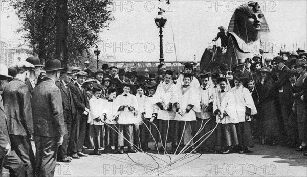 Choirboys of St Clement Danes beating the boundary-marks with long wands, London, 1926-1927. Artist: Unknown