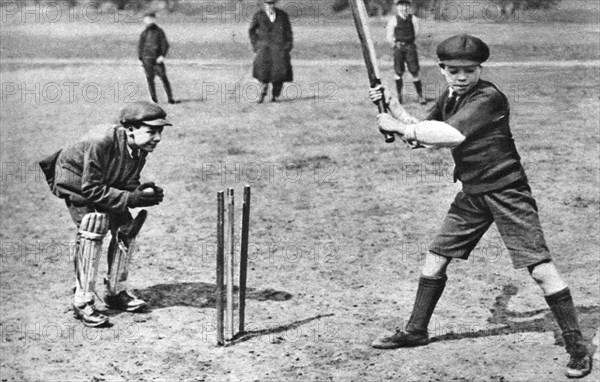 Boys playing cricket in Parliament Hill Fields, London, 1926-1927. Artist: Unknown