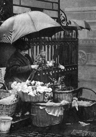 Flower seller, Piccadilly Circus, London, 1926-1927. Artist: Unknown