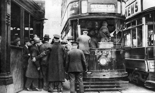 Getting on to a tram at Blackfriars, London, 1926-1927. Artist: Unknown
