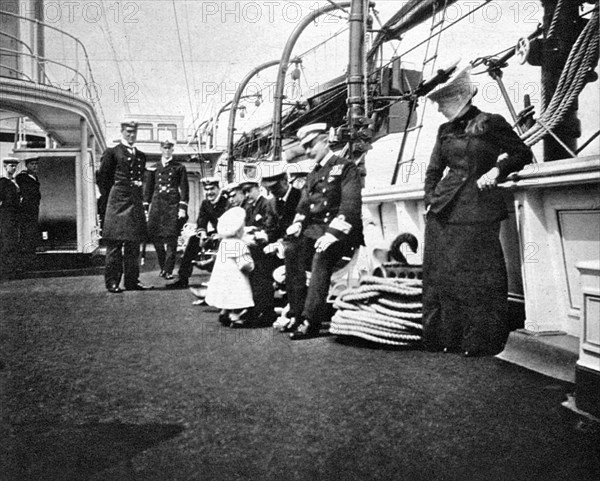 Prince Olav (1903-1991), the future King Olav V of Norway, conversing with naval officers, 1908.Artist: Queen Alexandra