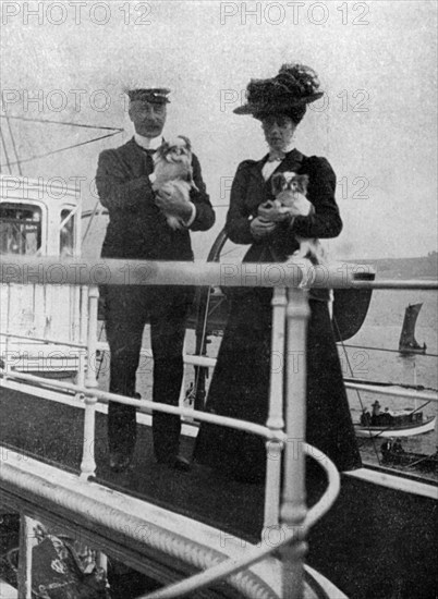 Princess Victoria (1868-1935) with the Queen's dogs, 1908.Artist: Queen Alexandra