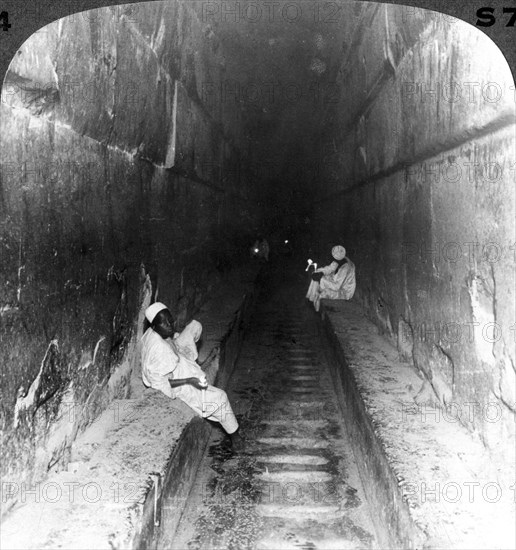 'Looking down the main passage to Khufu's sepulchre within the Great Pyramid, Egypt', 1905.Artist: Underwood & Underwood