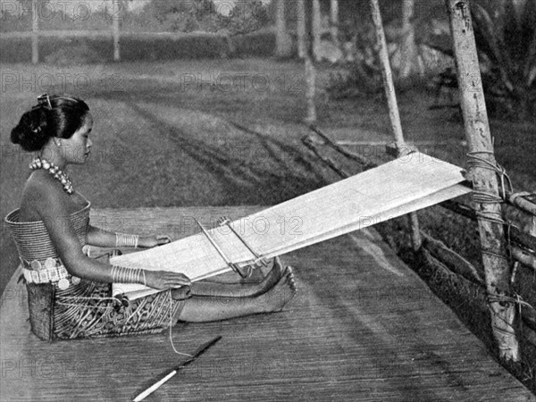 Iban weaver, Borneo, 1922. Artist: Dr Charles Hose