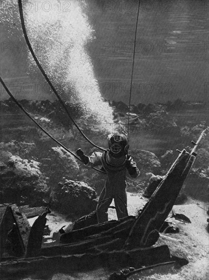 The first photograph of a diver under water, late 19th century, (c1920). Artist: Unknown