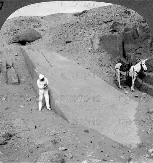 'Ninety-two foot obelisk still lying in the quarry of Assuan (Aswan), Egypt', 1905.Artist: Underwood & Underwood