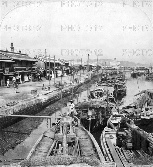 Native boats on a waterway in Yokohama, Japan, 1901.Artist: Clarence H White