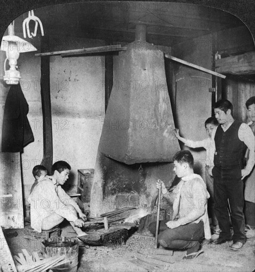 A Japanese blacksmith at his forge, Yokohama, Japan, 1904.Artist: Underwood & Underwood