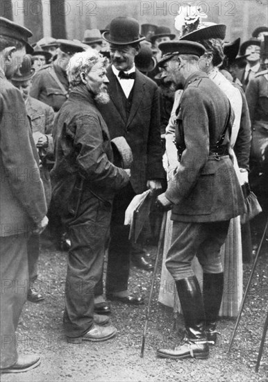 King George V and Queen Mary with a shipwright, Birkenhead, First World War, 1914-1918, (c1920). Artist: Unknown