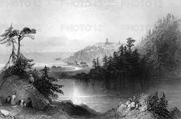 Lily Lake, with the town of St John on an outcrop beyond, Canada, 19th century.Artist: R Brandard