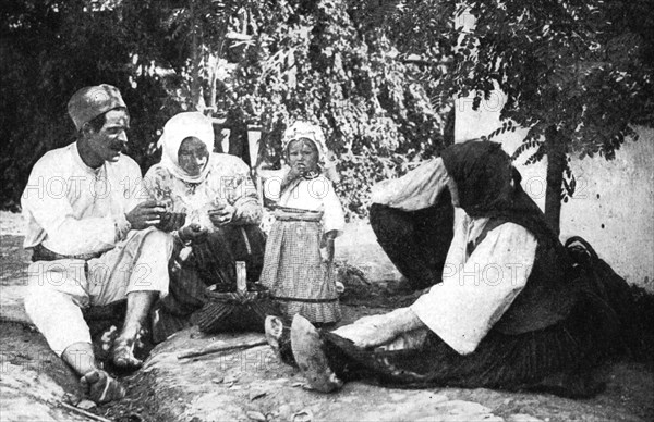 Serbian family telling the story of routing the Austrians from Bosnia, First World War, 1914. Artist: Unknown