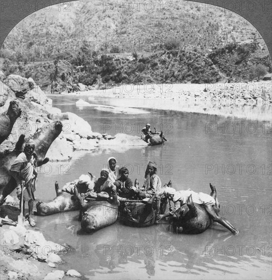 Inflated bullock skins used as ferry boats on the Sutlej River, Punjab, India, c1900s. Artist: Unknown