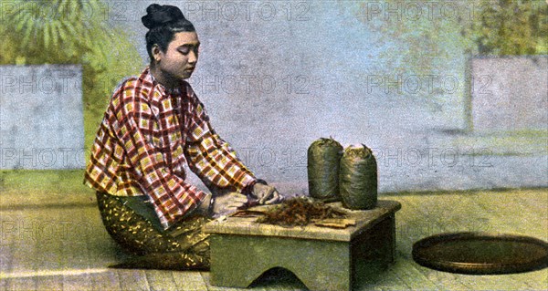 A Burmese woman making cigars, c1900s. Artist: Unknown