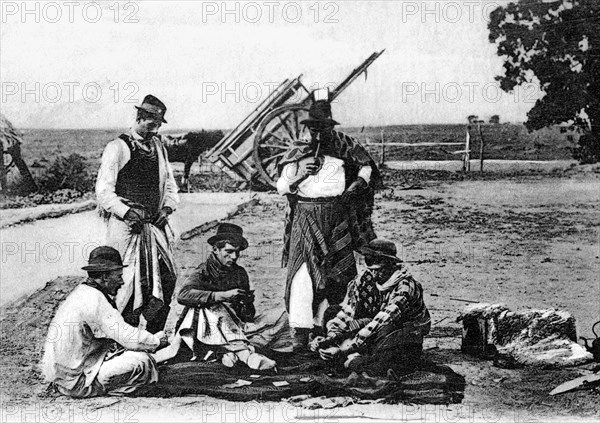 Three men playing cards, Uruguay, c1900s. Artist: Unknown