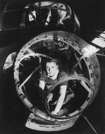 A woman working on a Lancaster bomber, Second World War, 1940s. Artist: Unknown