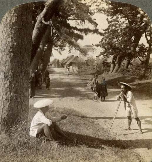 Travellers resting under the pines at Suzukawa, old post road from Tokyo to Kyoto, Japan, 1904.Artist: Underwood & Underwood