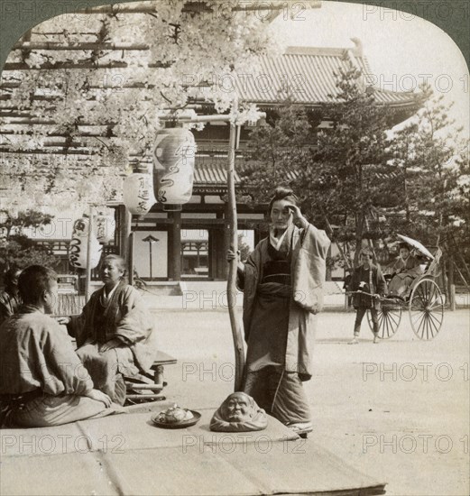 Drooping clusters of wisteria over a tea house porch, Kyoto, Japan, 1904. Artist: Underwood & Underwood