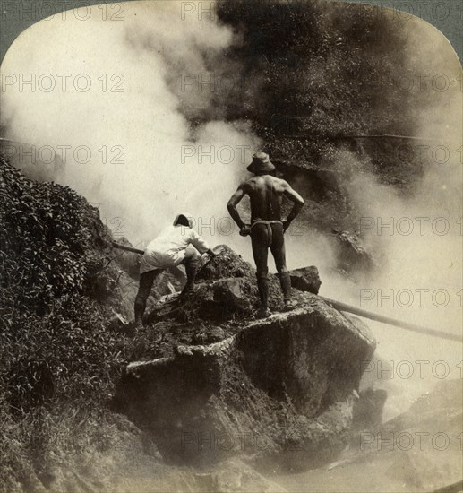 Watching an eruption of steam and boiling mud halfway up the volcano of Aso-san, Japan, 1904. Artist: Underwood & Underwood