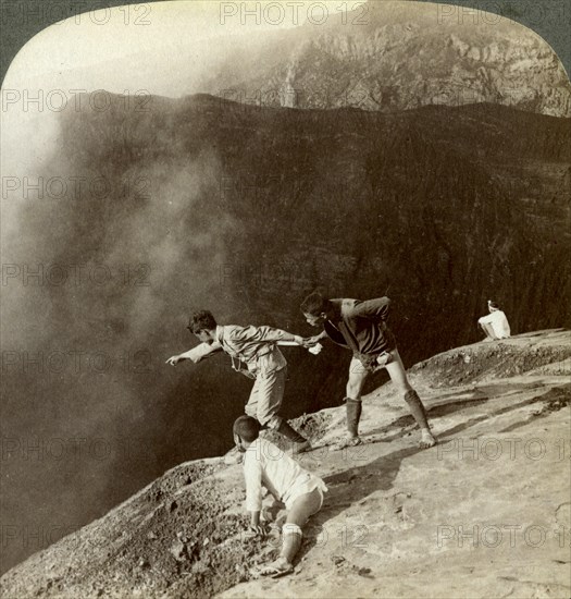 Gaving through sulphurous vapors into the crater's depths, Aso-San, Japan, 1904. Artist: Underwood & Underwood