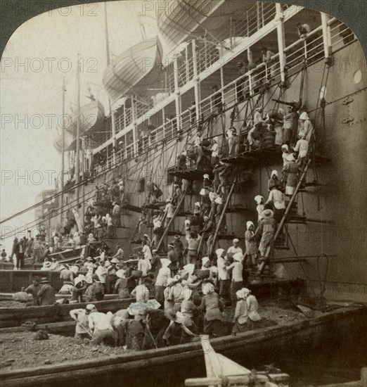 Coaling the Pacific mail SS 'Siberia', at the fortified naval station of Nagasaki, Japan, 1904. Artist: Underwood & Underwood