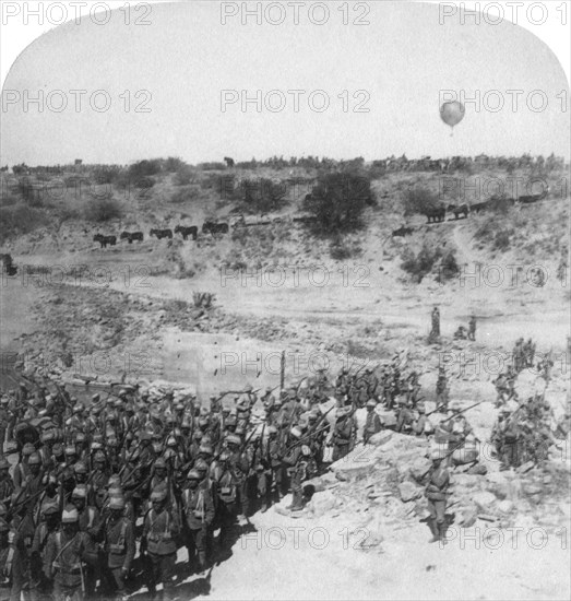 Lord Roberts' infantry crossing the Zand River, South Africa, 1900. Artist: Underwood & Underwood