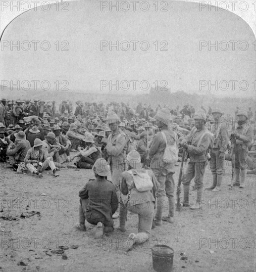 The overpowered Boer prisoners resting on the road from Paardeberg to Modder River, 1900. Artist: Underwood & Underwood