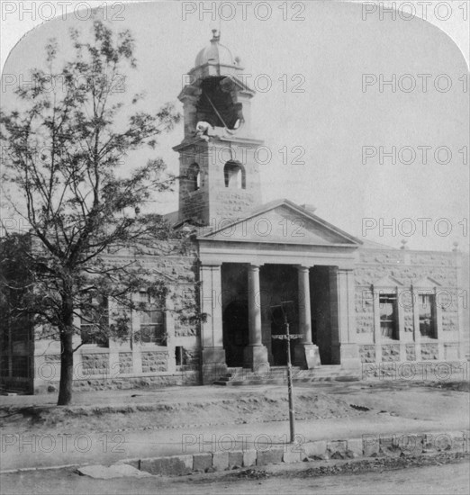 The Town Hall, struck by a Boer shell during the siege, Ladysmith, South Africa, 1901. Artist: Underwood & Underwood