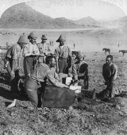 Making gas for one of the war balloons at Slingersfontein, South Africa, Boer War, 1900.Artist: Underwood & Underwood