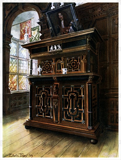 A cabinet of oak and walnut, 1910.Artist: Edwin Foley