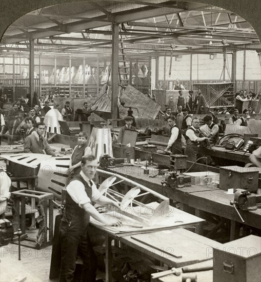 Sheet metal workers at a aeroplane factory, World War I, 1914-1918. Artist: Realistic Travels Publishers