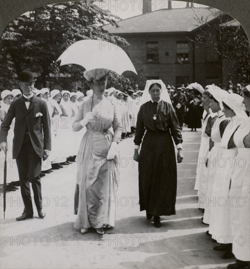 Her Majesty walking through the guard of honour of nurses of RN Hospital, Hull, 20th century. Artist: Realistic Travels Publishers